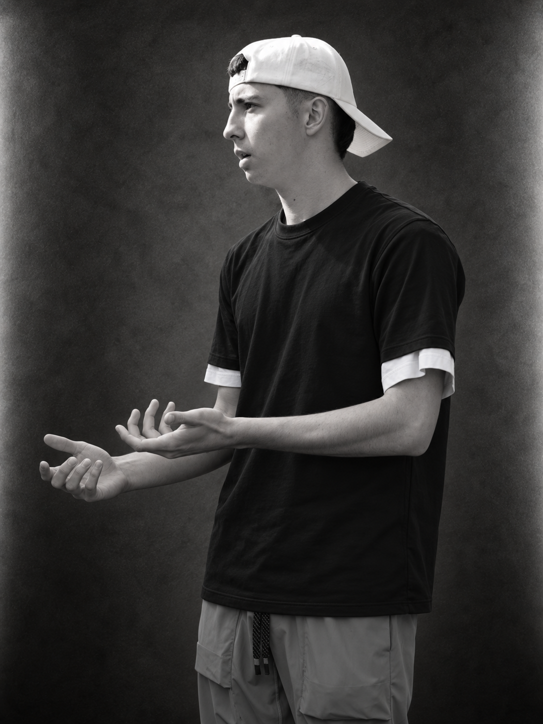 Mateo Martinez wearing a black shirt and a backwards cap
