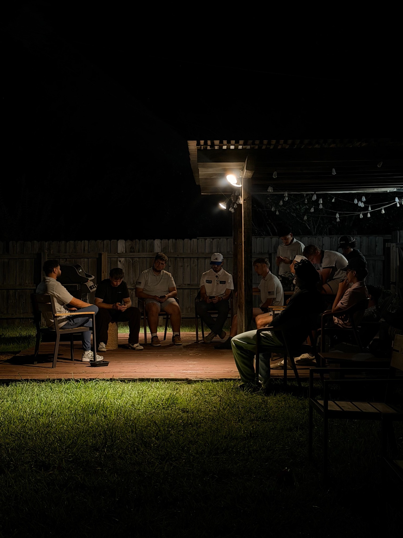 The team sitting together for a conversation at a night meeting